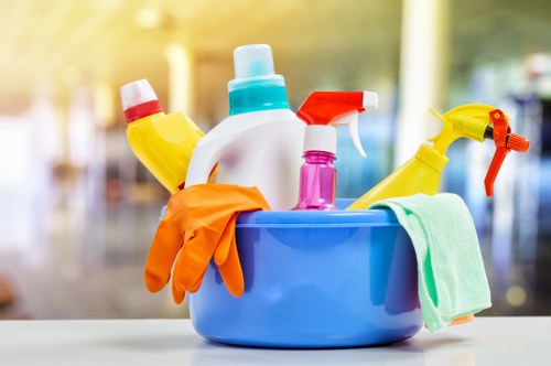 Carpet cleaning technician preparing equipment safely before starting work